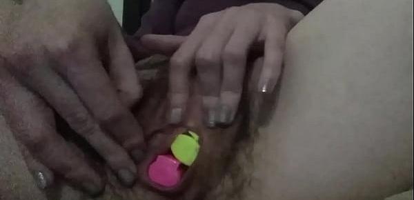  Girl fucks hairy puss with pen and stretches it